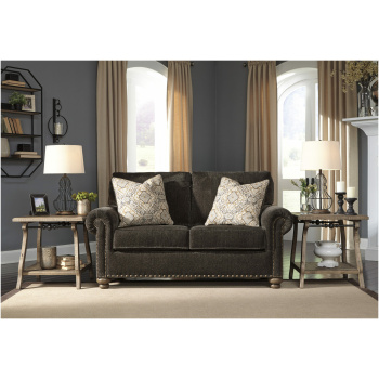 Διθέσιος καναπές της σειράς Stracelen, της Ahsley, επενδεδυμένος με βελούδινο ύφασμα σενίλ, σε σκούρο καφέ χρώμα. Στηρίζεται σε τέσσερα εμφανή πόδια.