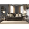 Τριθέσιος καναπές της σειράς Stracelen, της Ahsley, επενδεδυμένος με βελούδινο ύφασμα σενίλ, σε σκούρο καφέ χρώμα. Στηρίζεται σε τέσσερα εμφανή πόδια.