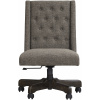 Περιστρεφόμενη καρέκλα γραφείου, με υφασμάτινη ταπετσαρία σε χρώμα γραφίτη και με διακοσμητικά κουμπιά. Στηρίζεται σε άξονα με ακτινωτή βάση.
