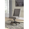 Περιστρεφόμενη καρέκλα γραφείου, με υφασμάτινη ταπετσαρία σε χρώμα γραφίτη και με διακοσμητικά κουμπιά. Στηρίζεται σε άξονα με ακτινωτή βάση.