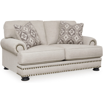 Διθέσιος καναπές Merrimore της Ashley, με ανοικτή μπεζ ταπετσαρία, αφράτα μαξιλάρια καθίσματος και πλάτης και τέσσερα εμφανή ξύλινα πόδια.